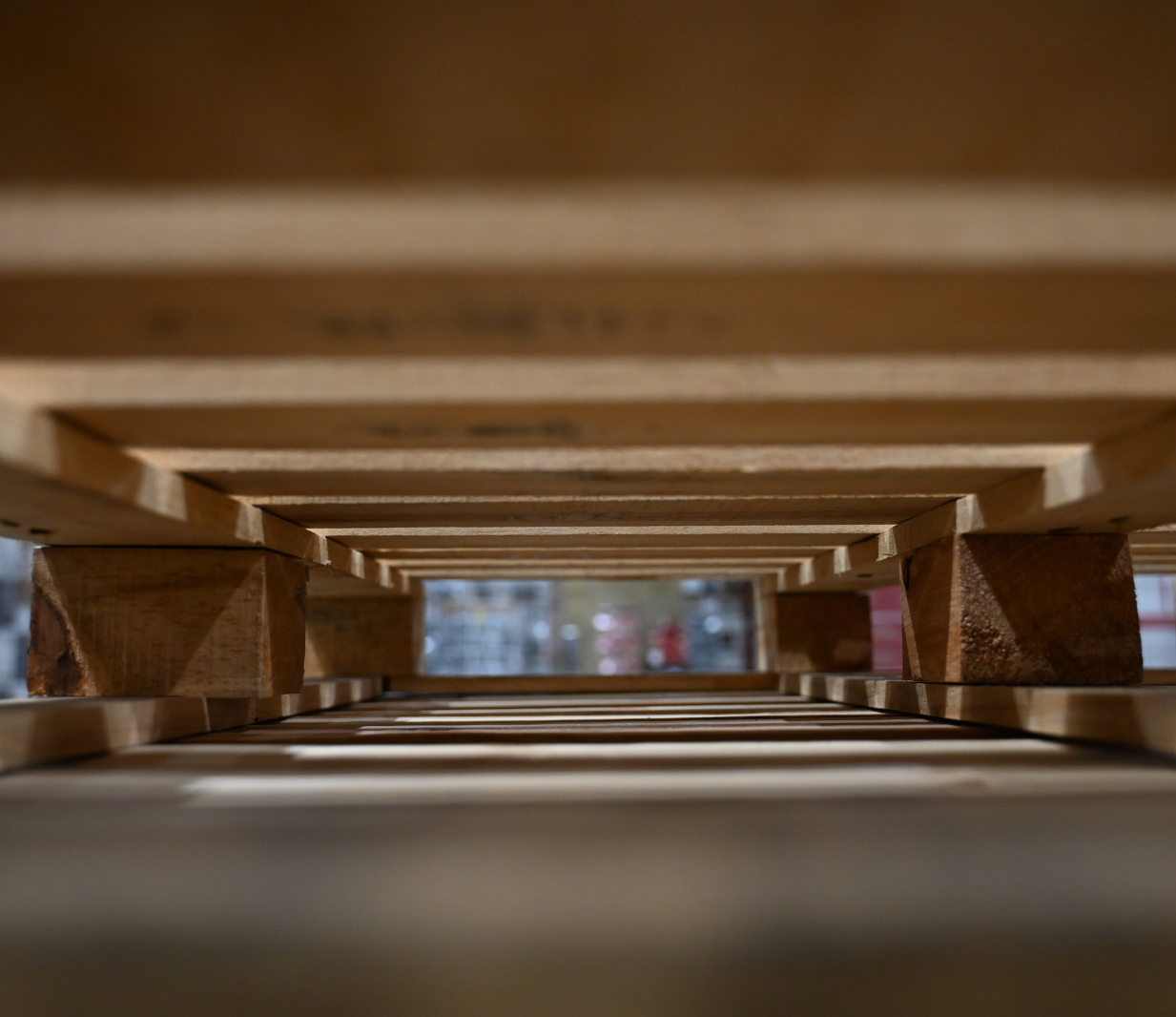 Looking through crates stacked for consolidation in a Jones Logistics warehouse in Shelbyville, Tennessee.