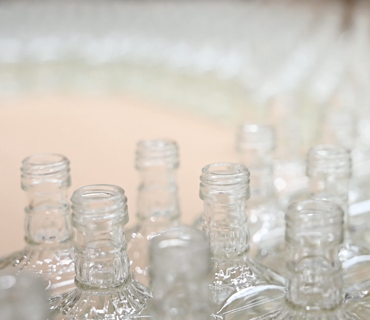 A sea of glass bottles wait for quality sorting in a Jones Logistics (JoLo) warehouse in Shelbyville, Tennessee.
