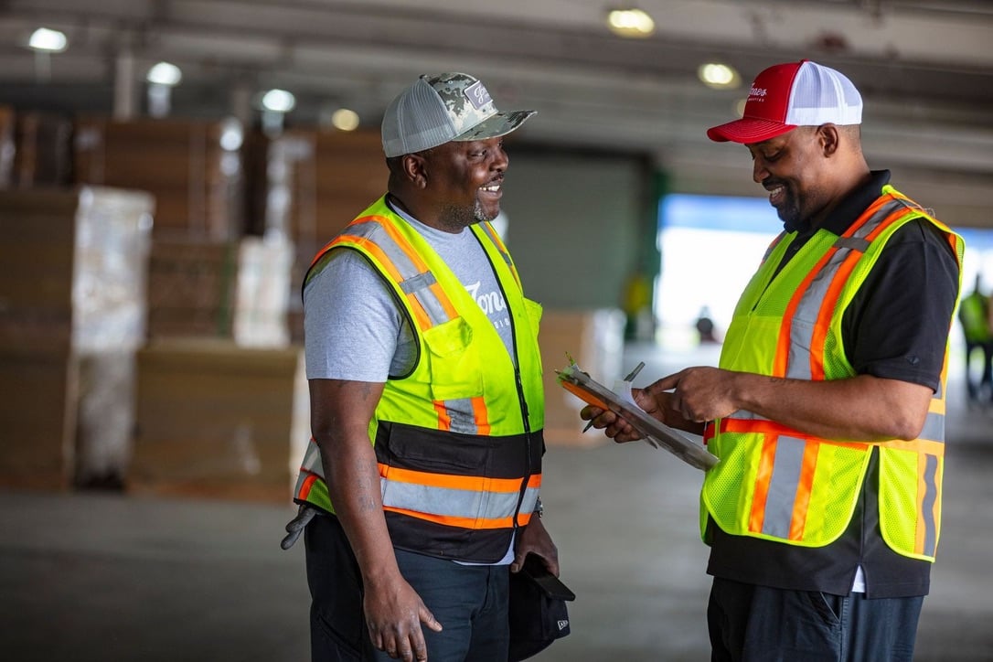 Two Jones Logistics (JoLo) employees in a warehouse in Lyons, Illinois.