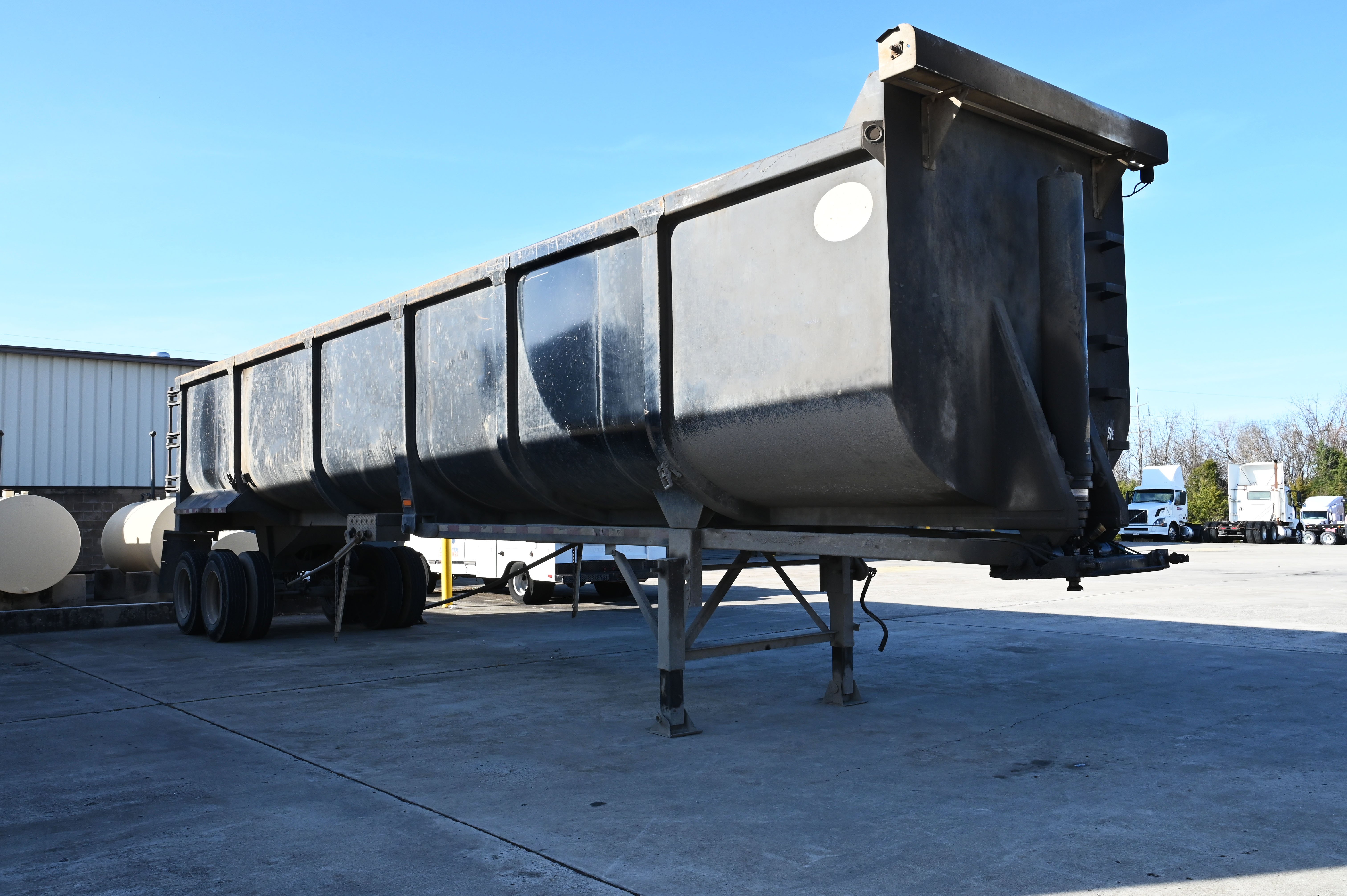 An end dump trailer sits in a lot near warehousing facility in Shelbyville, Tennessee.